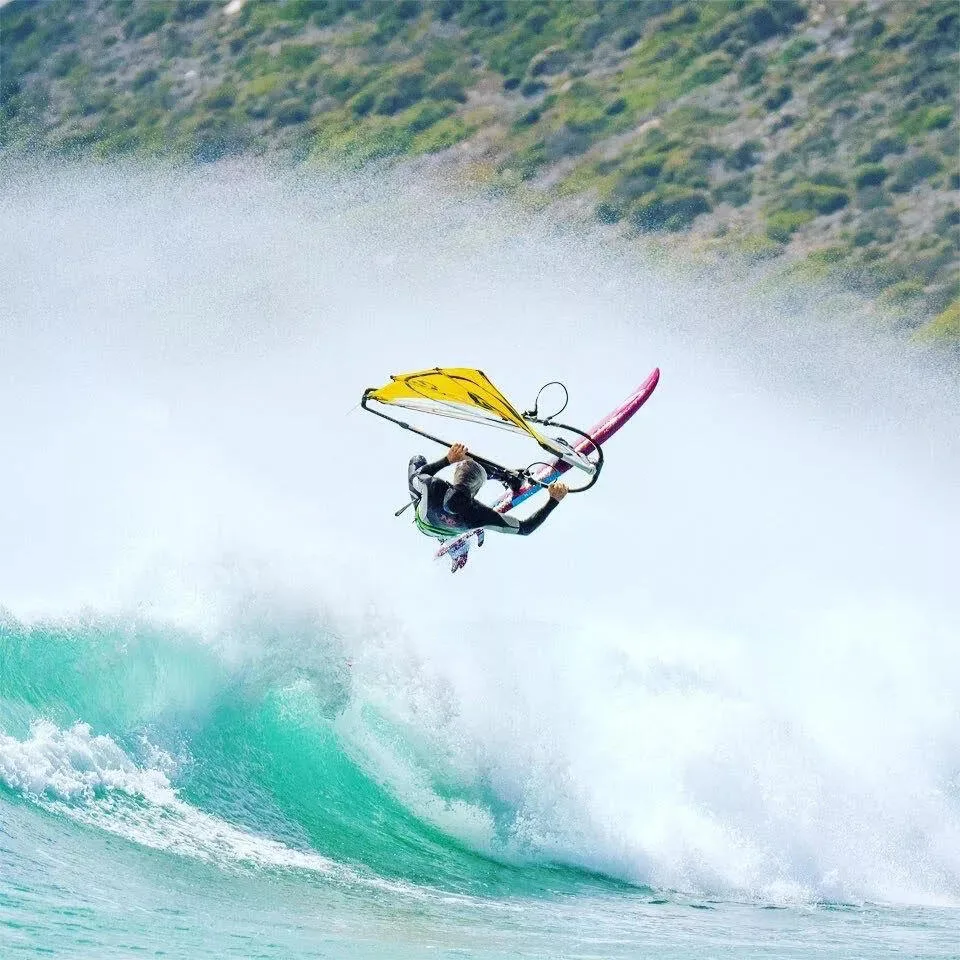 Matthew windsurfing off the Cape Town coastline.